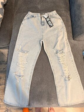The Kript Light Wash Distressed Wide Leg Jeans